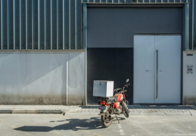 Home-delivery motorcycle parked outside